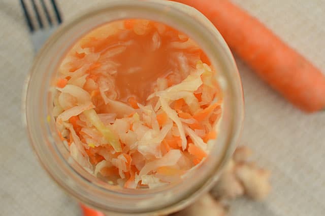 Top view of Ginger Garlic Sauerkraut in a jar. | MakeSauerkraut.com