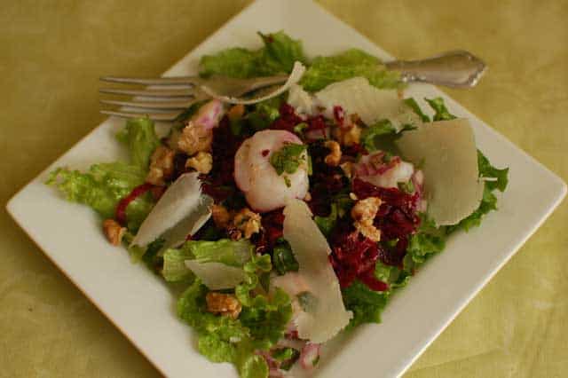 Passion Pink Salad with scallop ceviche in a white plate and fork to the side. | MakeSauerkraut.com