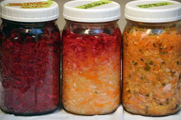 Three jars of filled sauerkraut. | MakeSauerkraut.com