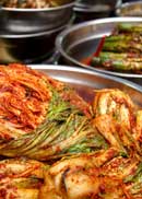 Korean kimchi in a metal bowl. | MakeSauerkraut.com