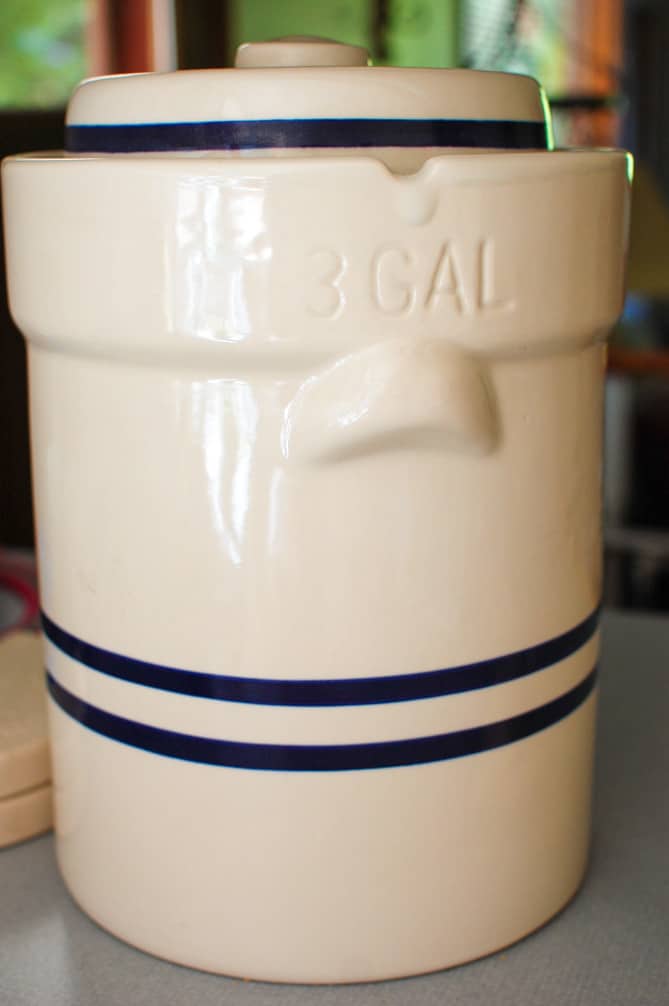 Large white fermentation crock with blue stripes. | MakeSauerkraut.com