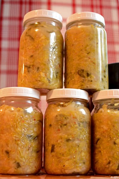 Rows of SFSK fermented in a crock and packed into jars. | MakeSauerkraut.com