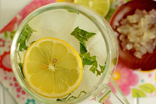 Top view of fermented coconut water with lemon and mint in a glass. | MakeSauerkraut.com