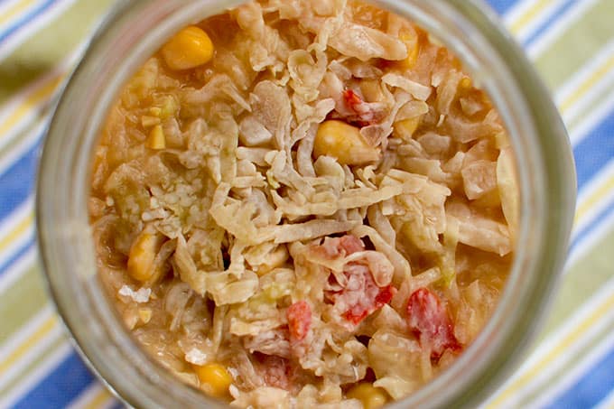 Top view of an opened jar of sauerkraut with kahm yeast over the vegetables. | MakeSauerkraut.com