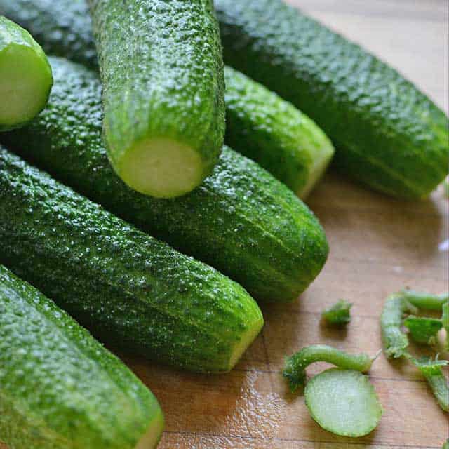 Close-up of cucumbers with cut stems. | MakeSauerkraut.com