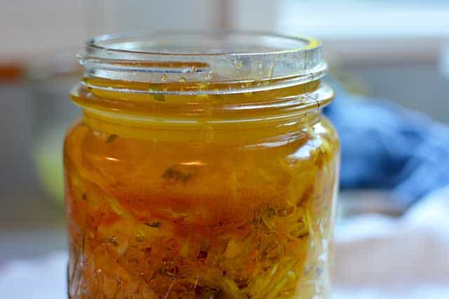 Front and close up view of an open jar of sauerkraut. | MakeSauerkraut.com