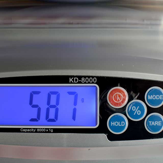 Front view of MyWeigh KD-8000 digital scale monitor showing 587. | MakeSauerkraut.com