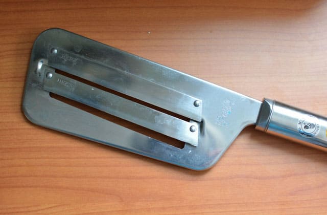 A steel cabbage knife with double blades in the middle. | MakeSauerkraut.com