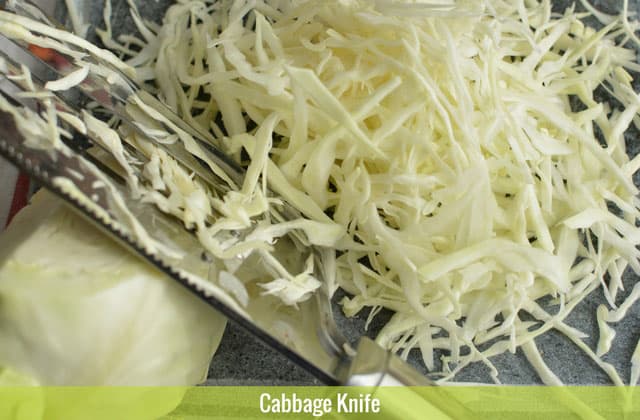 A pile of thinly sliced cabbages using a cabbage knife. | MakeSauerkraut.com