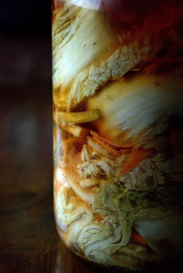 Close-up of a jar filled with Baek(white) kimchi. | MakeSauerkraut.com