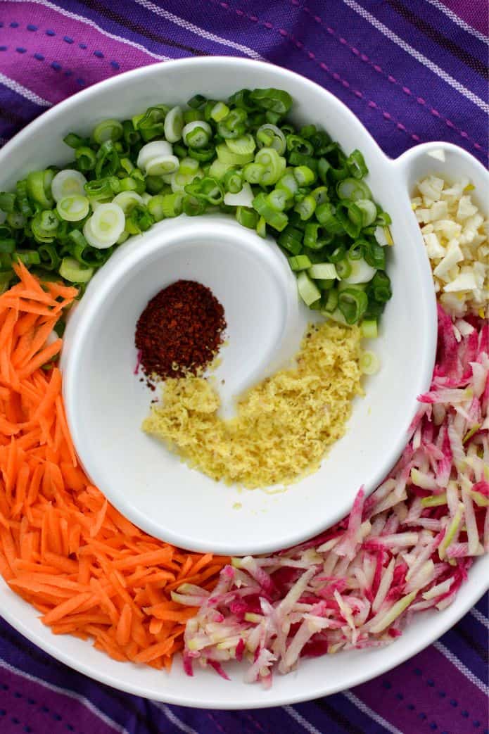 Ingredients for kimchi style sauerkraut prepared and placed in a bowl. | MakeSauerkraut.com