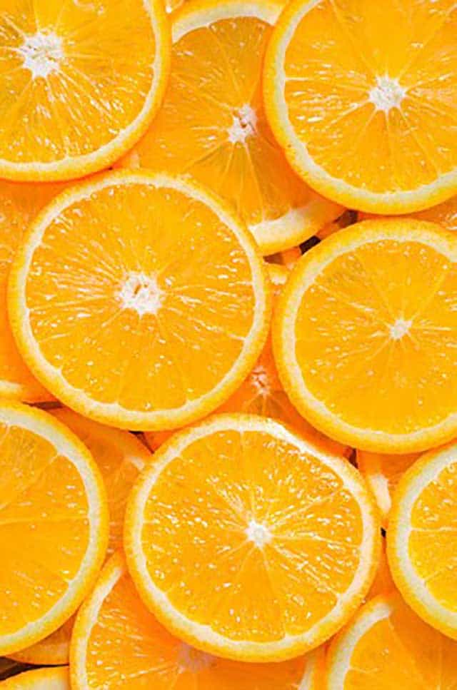 Orange slices filling up the entire image. | MakeSauerkraut.com