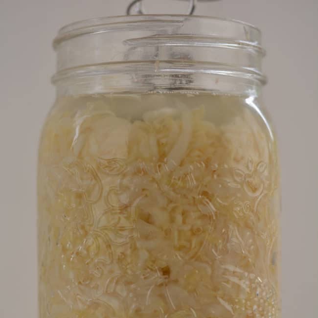 Front view view of a plain sauerkraut using the Kraut Source fermentation weight at day 7. | MakeSauerkraut.com