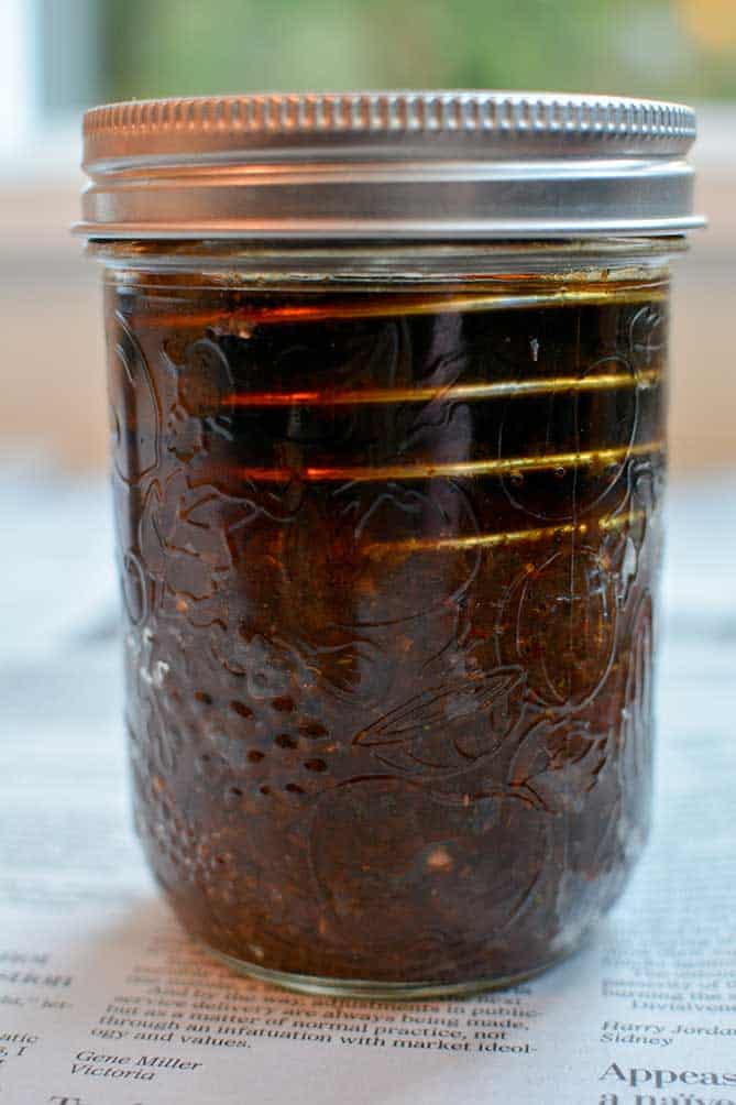 Front view of PickleHelix used in a jar of fermenting Raisin Chutney. | MakeSauerkraut.com