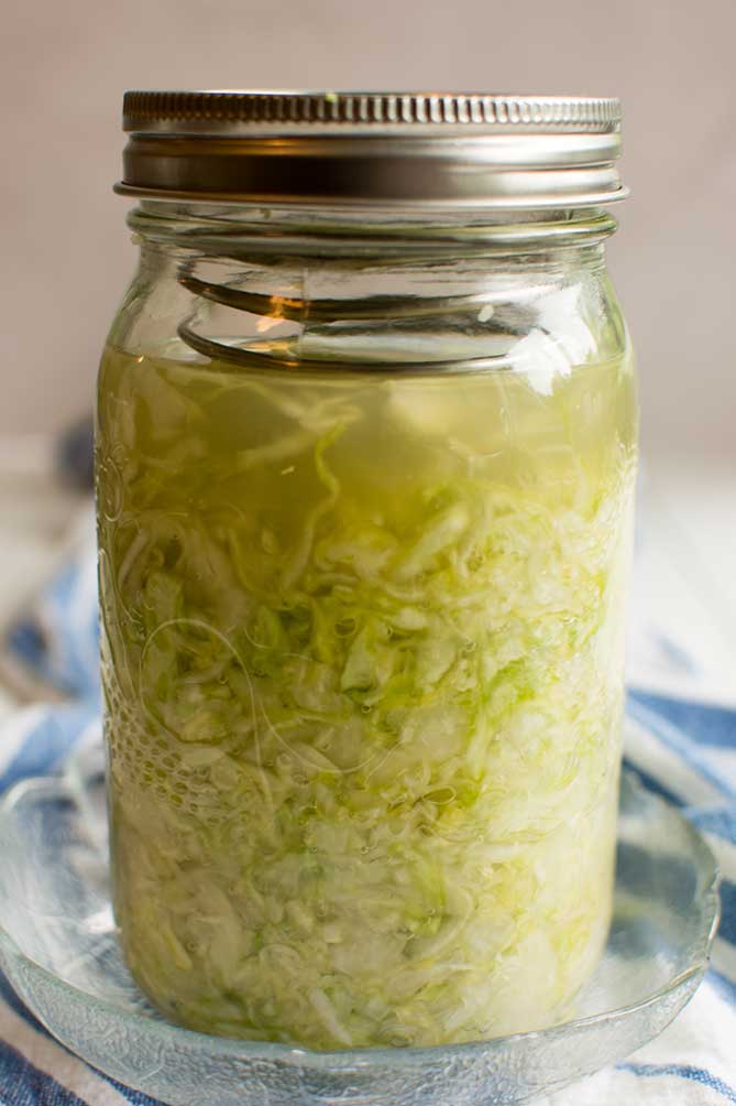 Front view of the PickleHelix used in a jar of fermenting sauerkraut. | MakeSauerkraut.com