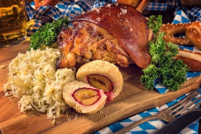 Roast pork and sauerkraut on cutting board. | MakeSauerkraut.com