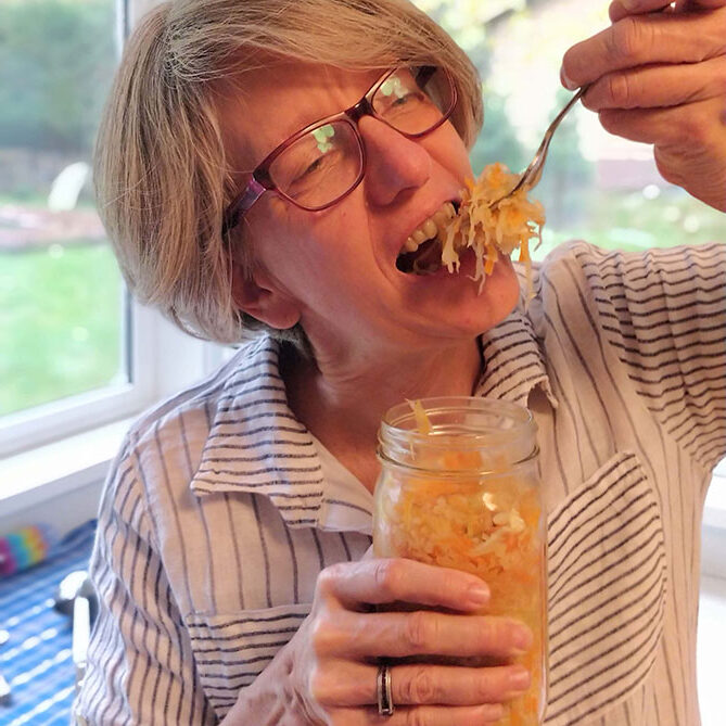 Holly Howe a forkful of sauerkraut right out of the jar. | MakeSauerkraut.com