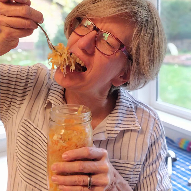 Holly Howe a forkful of sauerkraut right out of the jar. | MakeSauerkraut.com