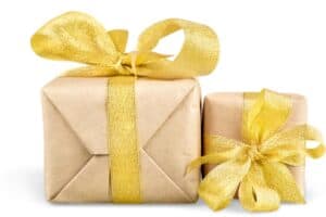 Two packages wrapped in brown paper with gold ribbon. | MakeSauerkraut.com