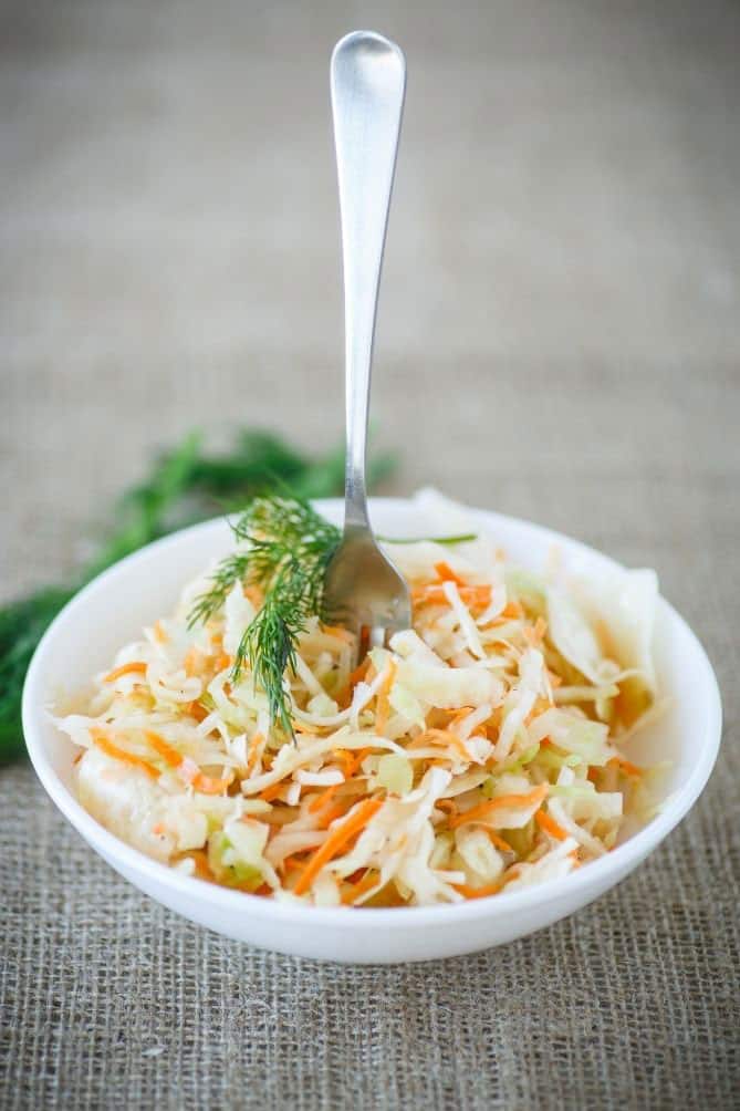 why-eat-sauerkraut Fork in bowl of probiotic-rich sauerkraut. | MakeSauerkraut.com