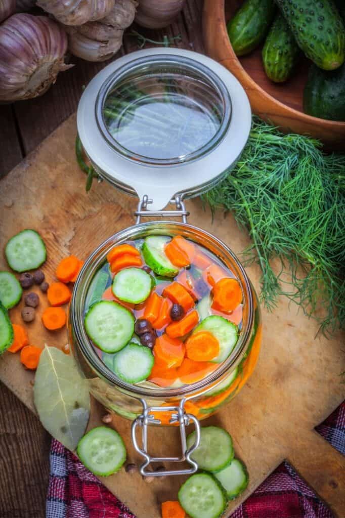 A jar of cucumbers and carrots ready to be pickled. |} MakeSauerkraut.com