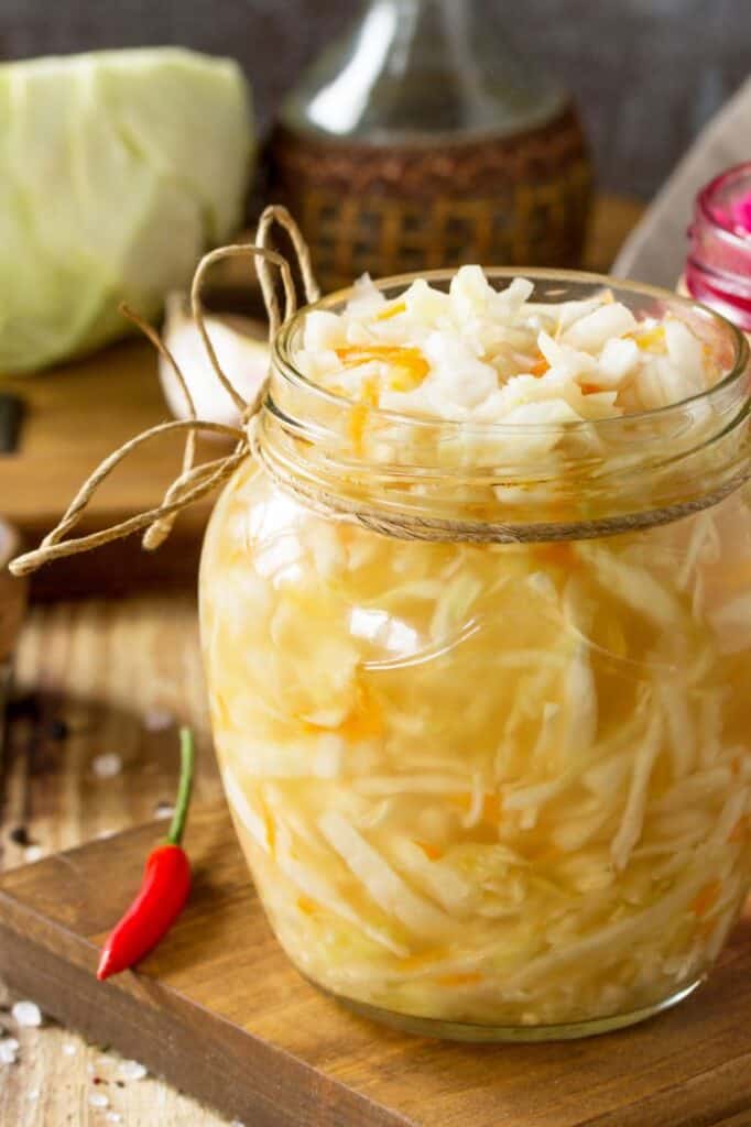 An opened jar of sauerkraut