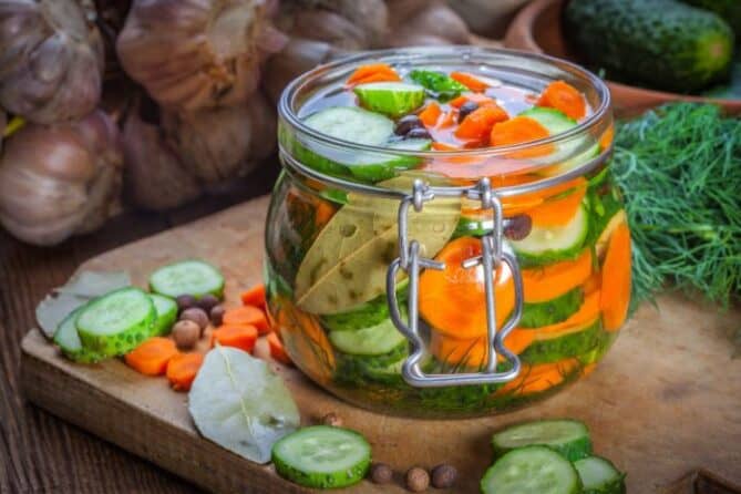 Jar of sliced carrots and cucumbers ready to be fermented. | MakeSauerkraut.com