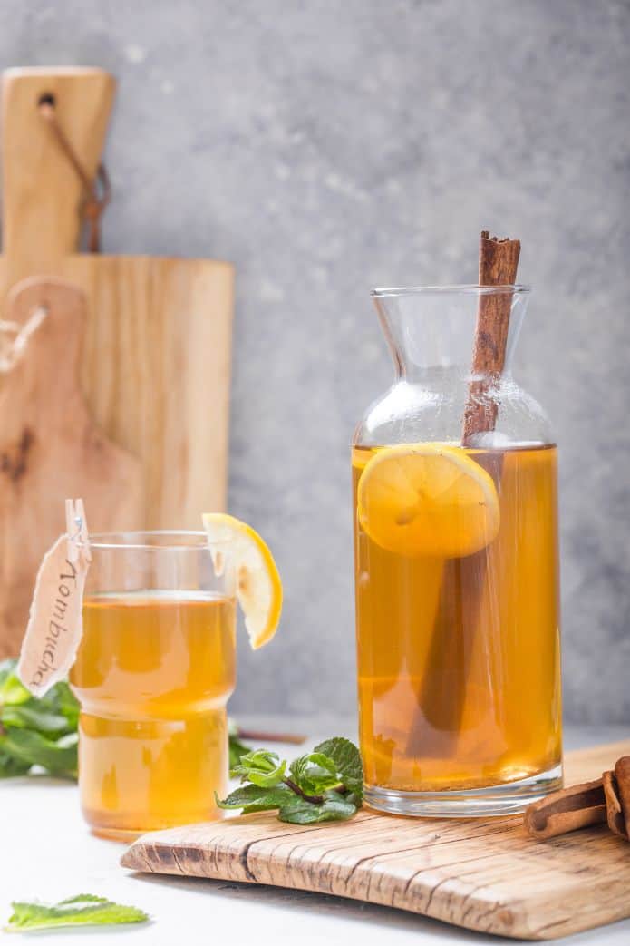 Jar and glass of kombucha tea. | MakeSauerkraut.com