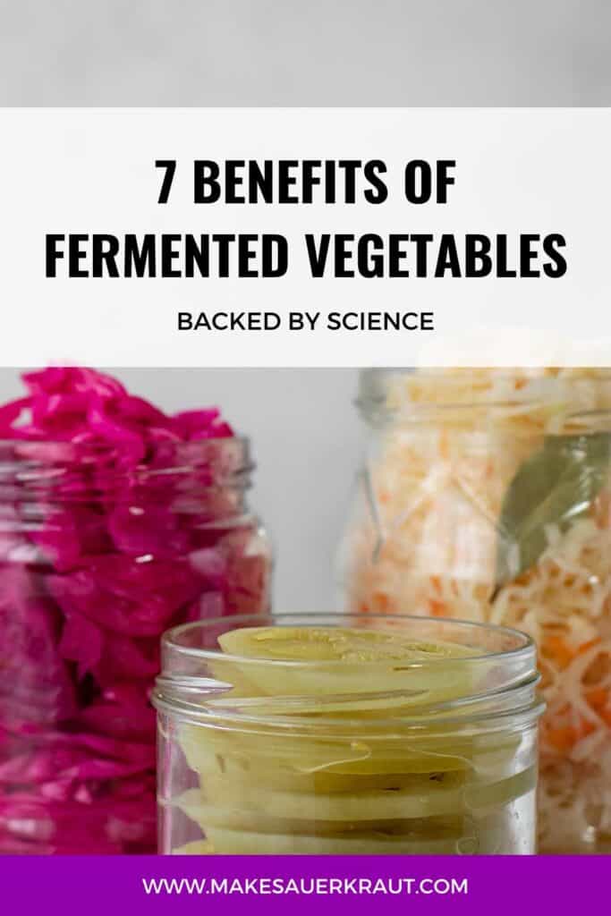 Assorted fermented vegetables in jars with text overlay 7 Benefits of Fermented Vegetables Backed by Science. | MakeSauerkraut.com
