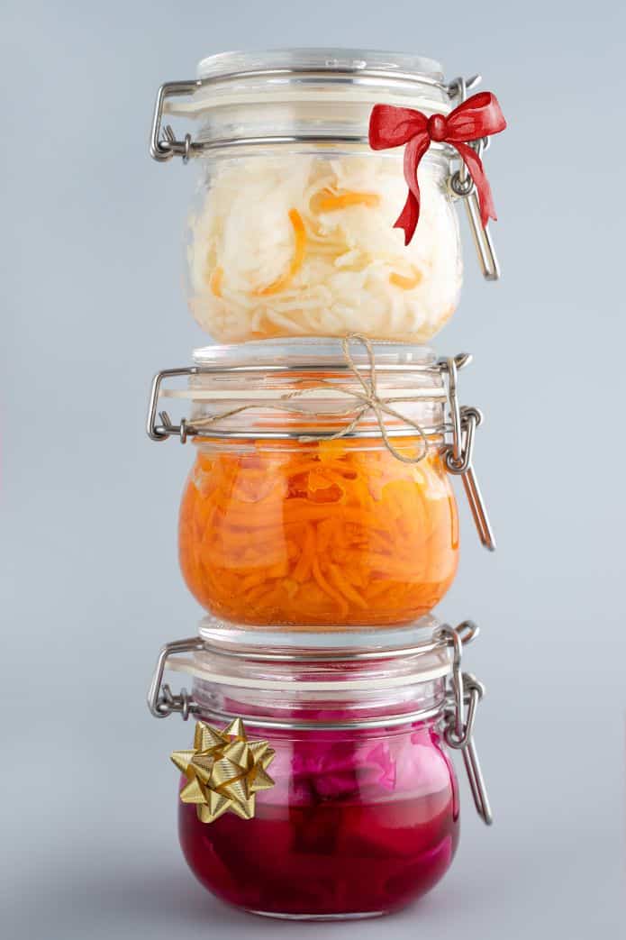 best fermentation gift Stack of 3 jars of sauerkraut with ribbons. | MakeSauerkraut.com