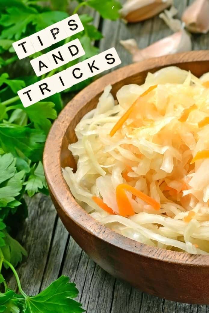 A wooden bowl of sauerkraut. | makesauerkraut.com