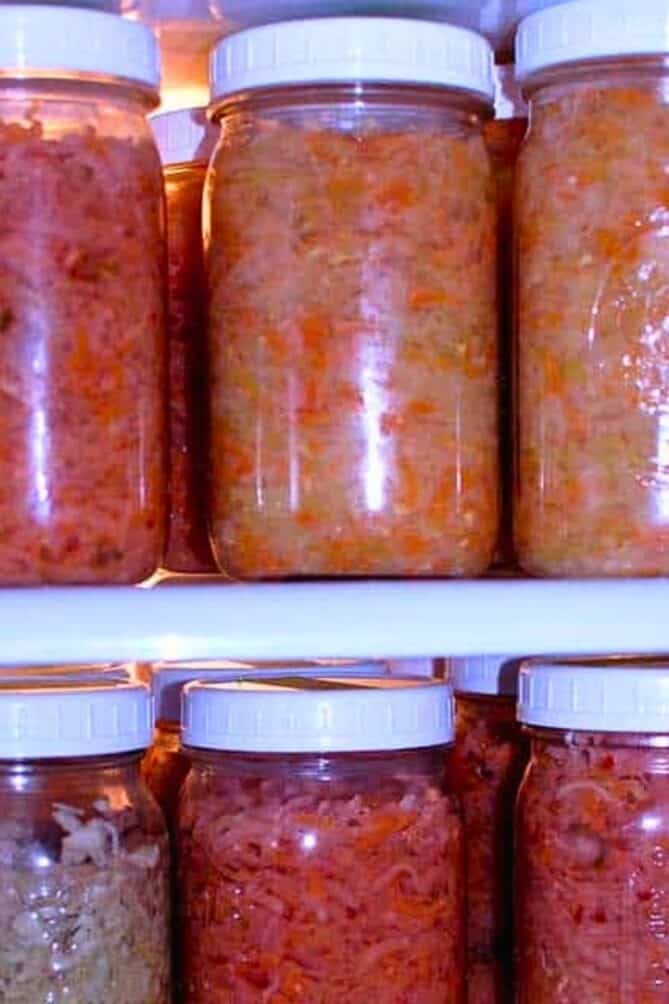 Jars of sauerkraut in a refrigerator. | makesauerkraut.com